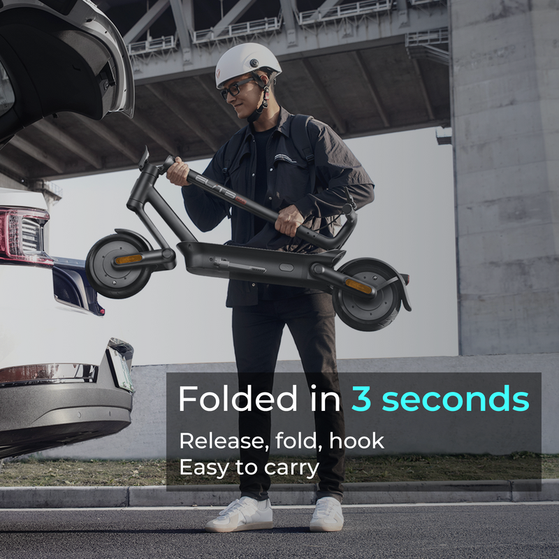 Load image into Gallery viewer, a male model is putting a folded escooter into the trunk of a car
